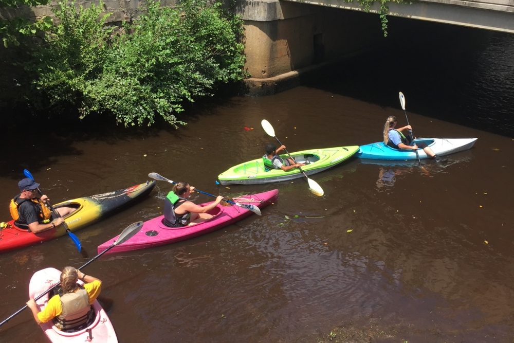 Kayaking-under-the-bridge-on-Washington-St-at-low-tide-1000x667